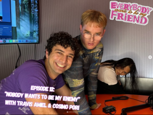 photo of travis and cosimo and ai vy posing.